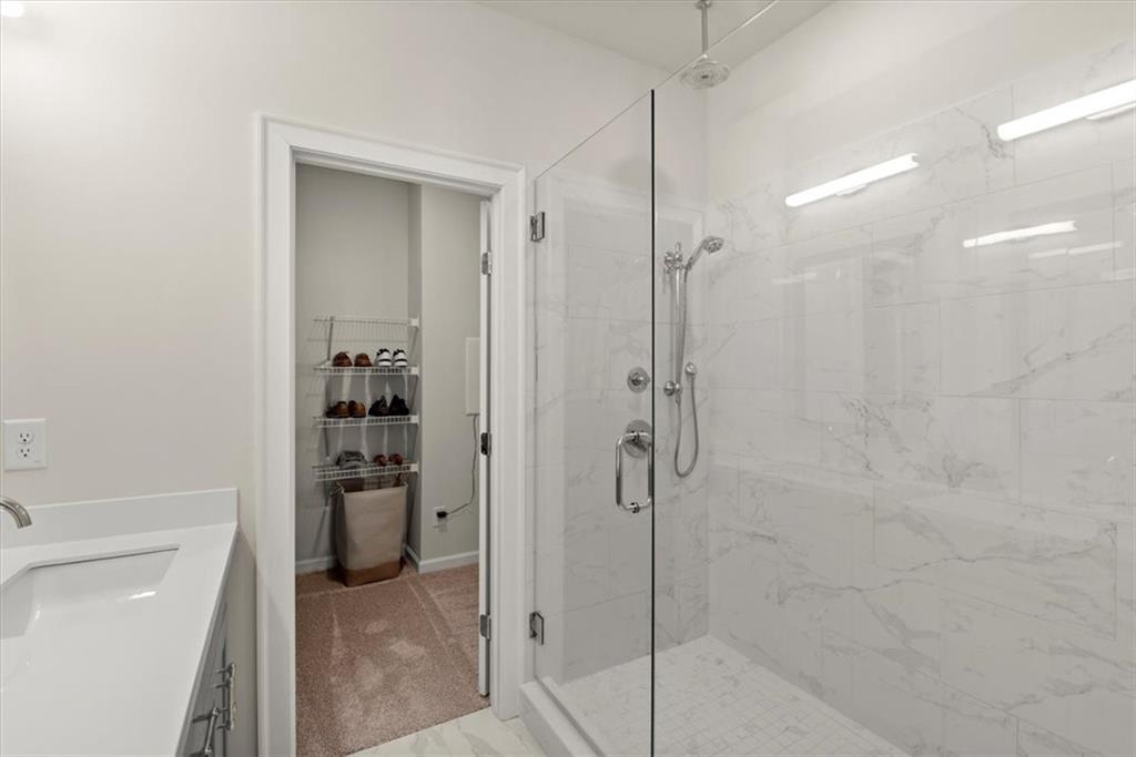 4217 Deming Circle Atlanta, GA 30342 - Photo 20 of 36 a bathroom with a shower and a sink