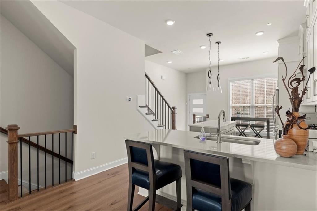 4217 Deming Circle Atlanta, GA 30342 - Photo 25 of 36 a dining room with furniture and wooden floor