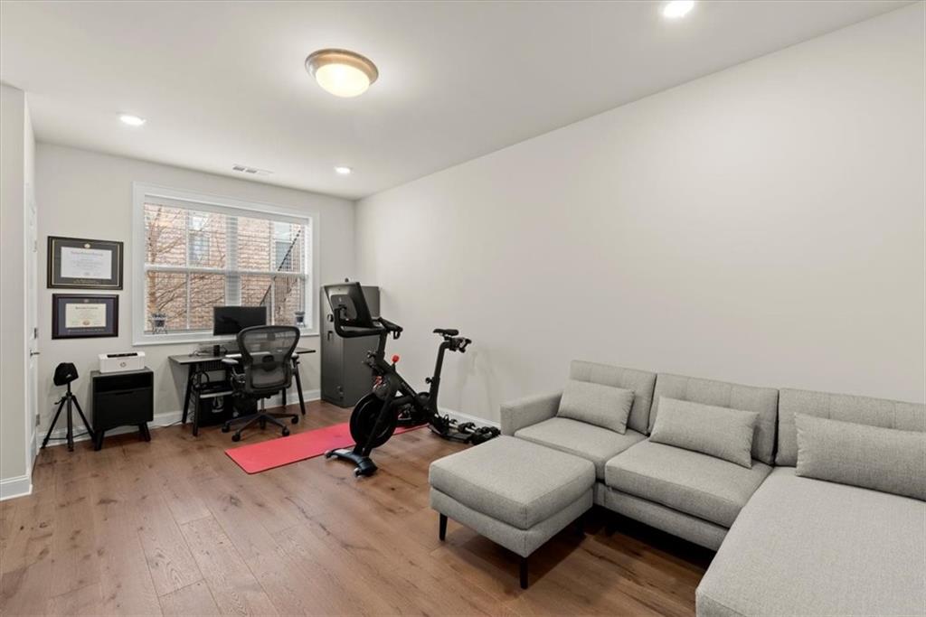 4217 Deming Circle Atlanta, GA 30342 - Photo 27 of 36 a living room with furniture and a flat screen tv