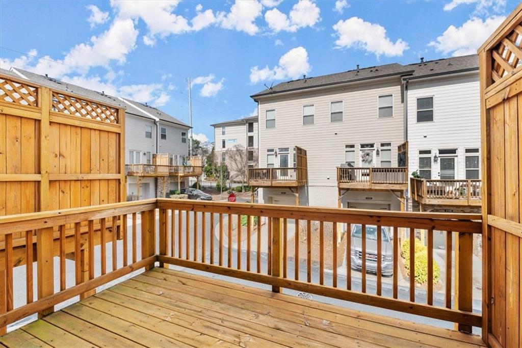 4217 Deming Circle Atlanta, GA 30342 - Photo 30 of 36 a view of a balcony with wooden floor and fence