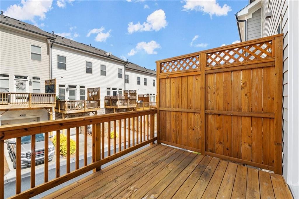 4217 Deming Circle Atlanta, GA 30342 - Photo 31 of 36 a view of a balcony with wooden floor
