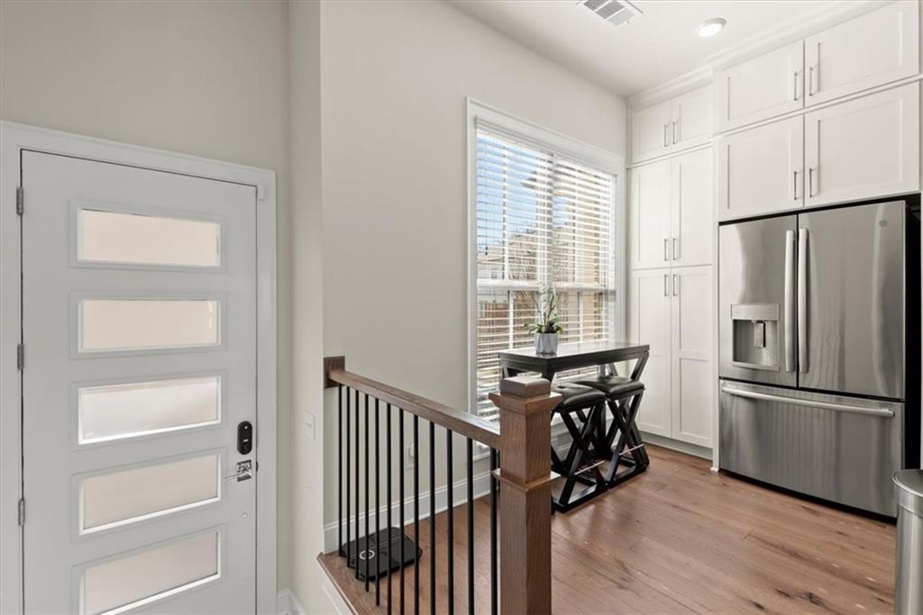 4217 Deming Circle Atlanta, GA 30342 - Photo 6 of 36 a view of a room with wooden floor electronic appliances and windows