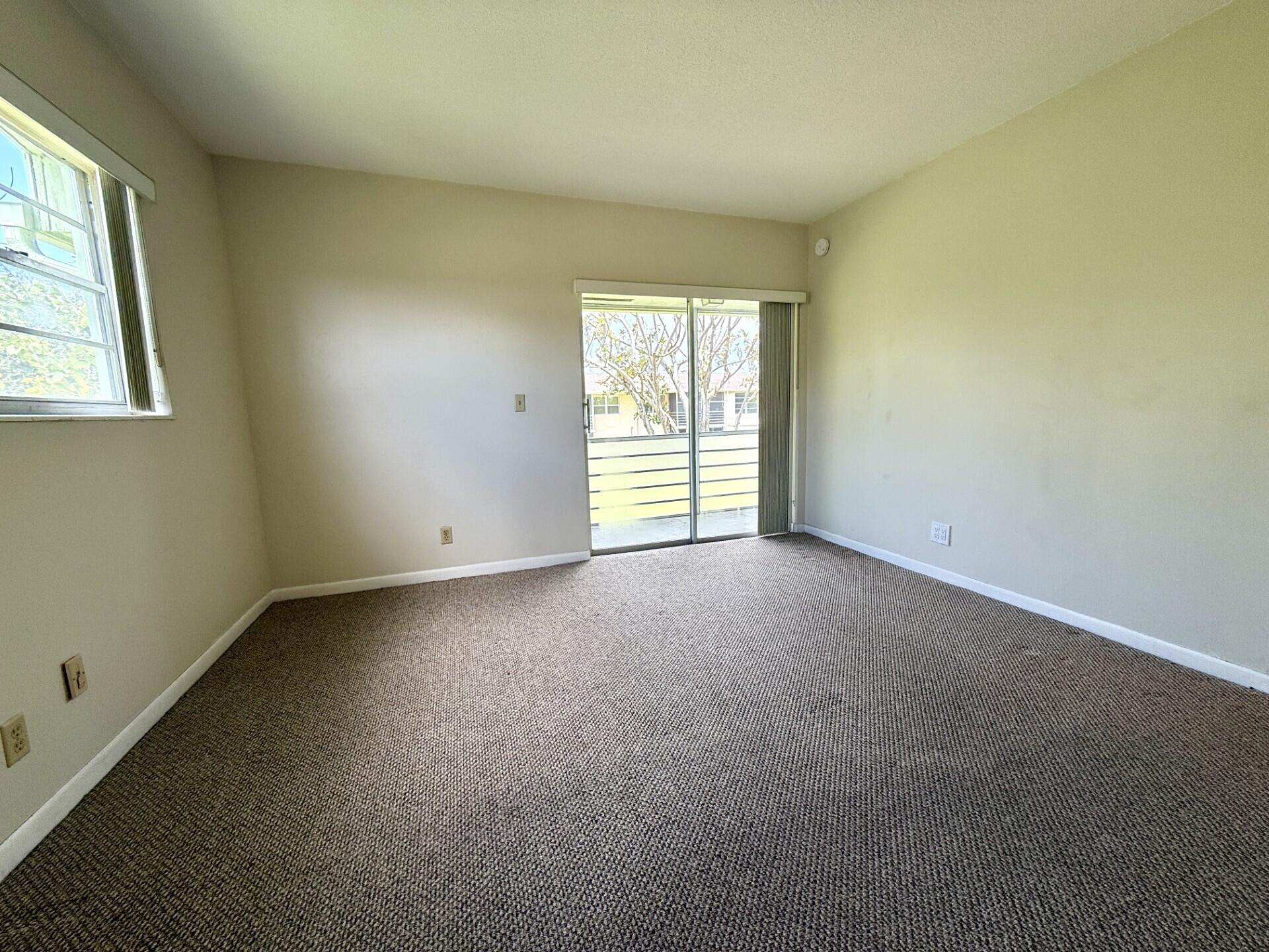 69 Norwich C West Palm Beach, FL 33417 - Photo 4 of 17 an empty room with windows