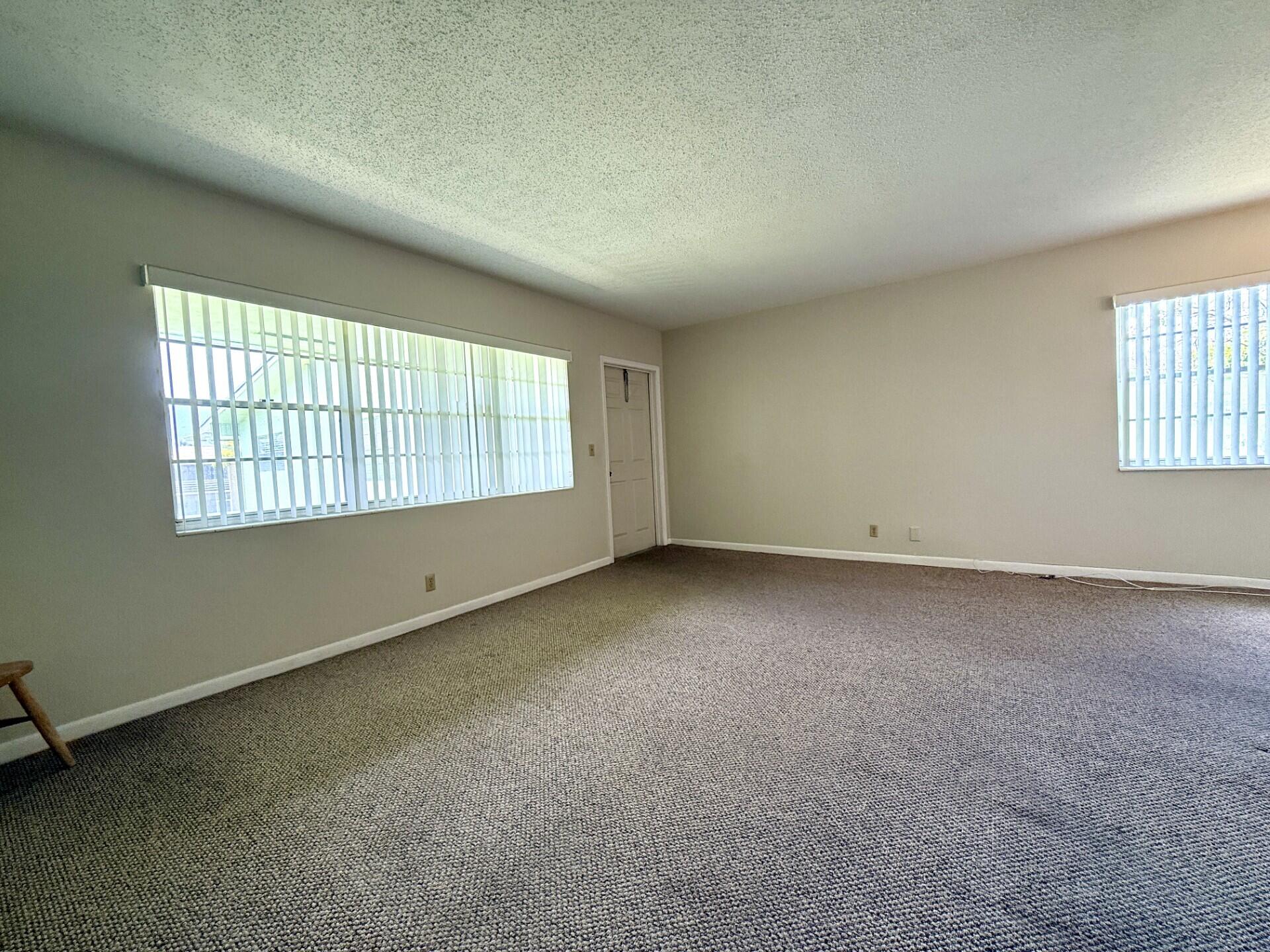 69 Norwich C West Palm Beach, FL 33417 - Photo 6 of 17 an empty room with a window