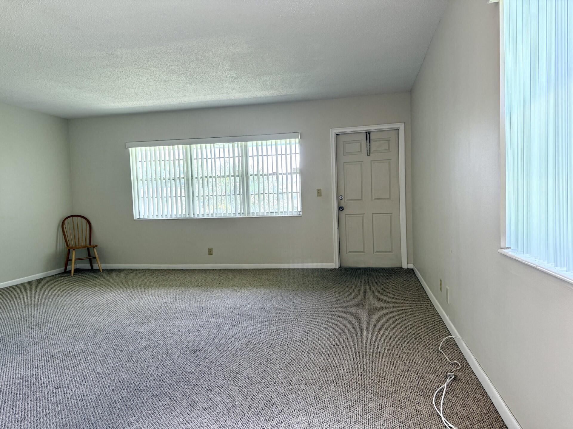 69 Norwich C West Palm Beach, FL 33417 - Photo 8 of 17 an empty room with a window