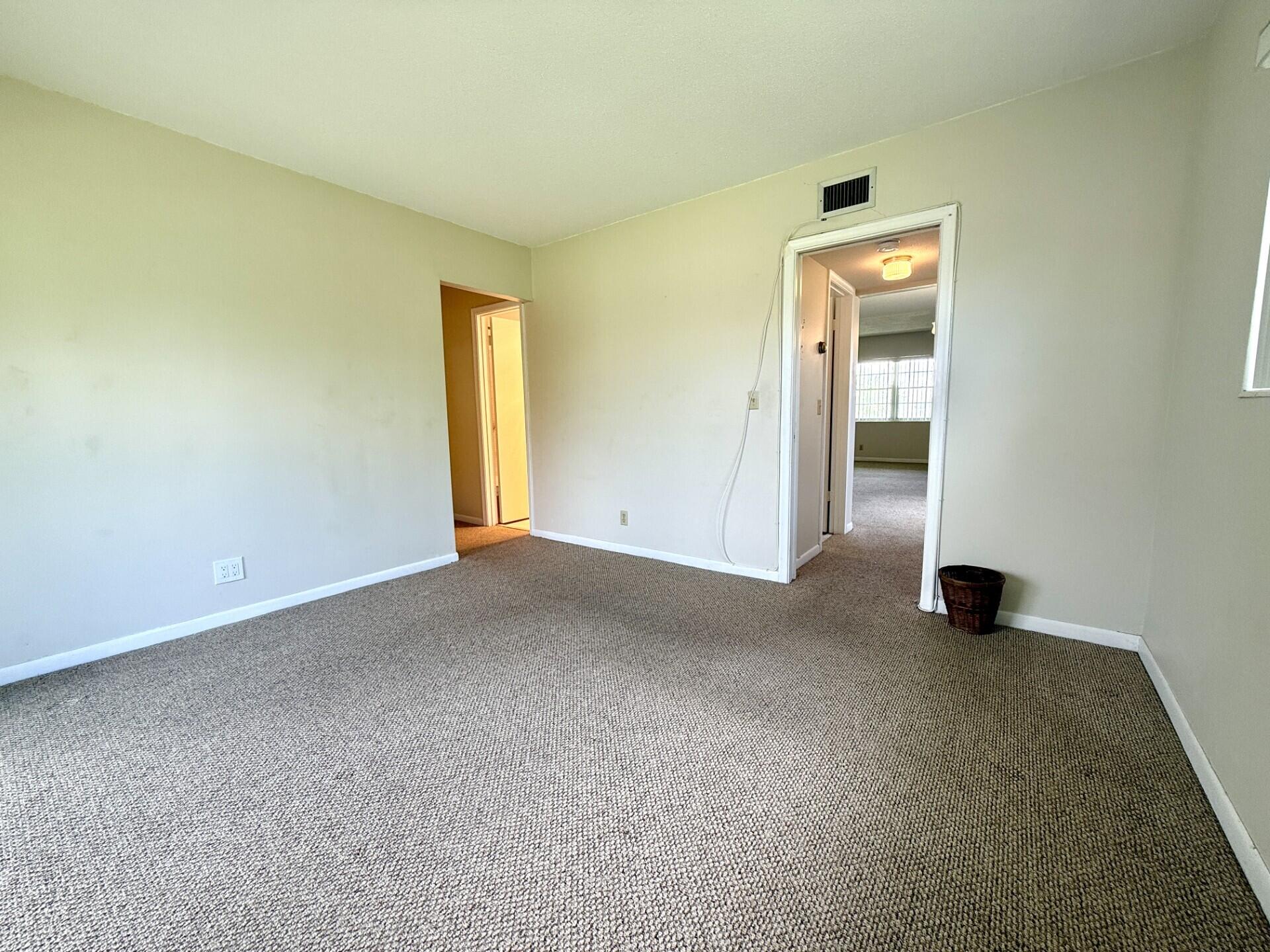 69 Norwich C West Palm Beach, FL 33417 - Photo 9 of 17 an empty room with windows