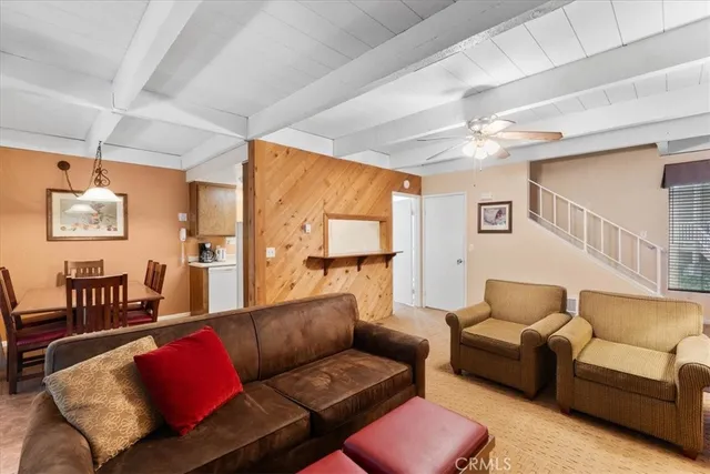 a living room with furniture and a lamp