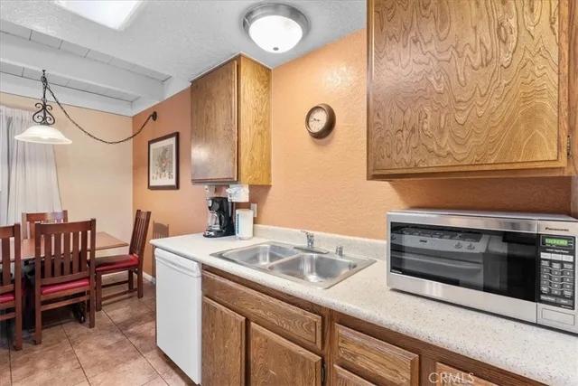 a kitchen with a sink and a stove top oven
