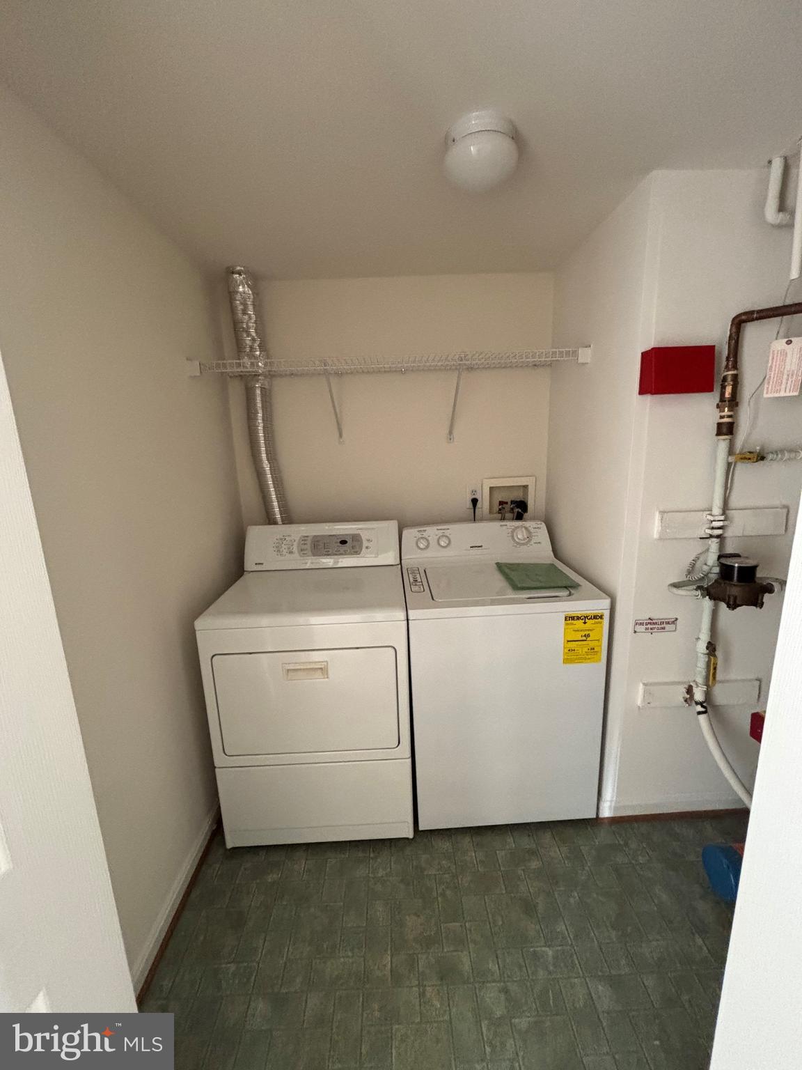 7403 Berryleaf Drive Laurel, MD 20707 - Photo 13 of 17 a utility room with dryer and washer