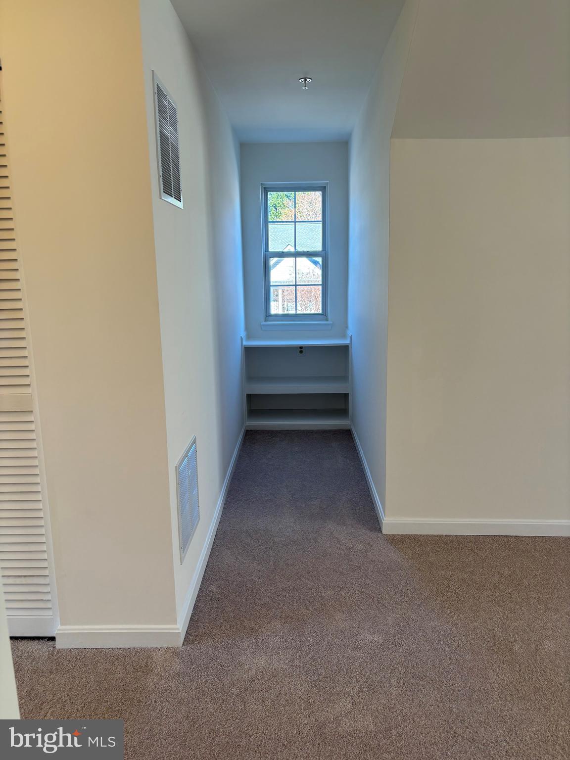 7403 Berryleaf Drive Laurel, MD 20707 - Photo 14 of 17 wooden floor in an empty room with a window