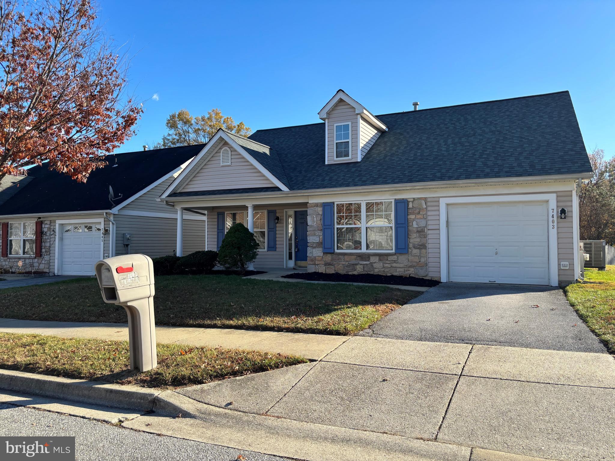 7403 Berryleaf Drive Laurel, MD 20707 - Photo 2 of 17 a front view of a house with garden