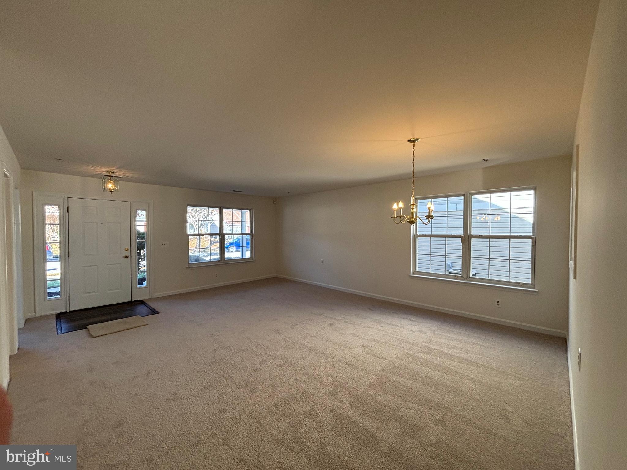 7403 Berryleaf Drive Laurel, MD 20707 - Photo 3 of 17 an empty room with windows and ceiling fan
