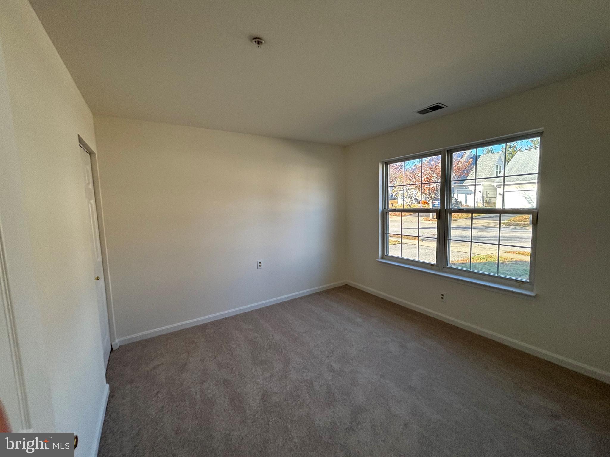 7403 Berryleaf Drive Laurel, MD 20707 - Photo 5 of 17 an empty room with a window