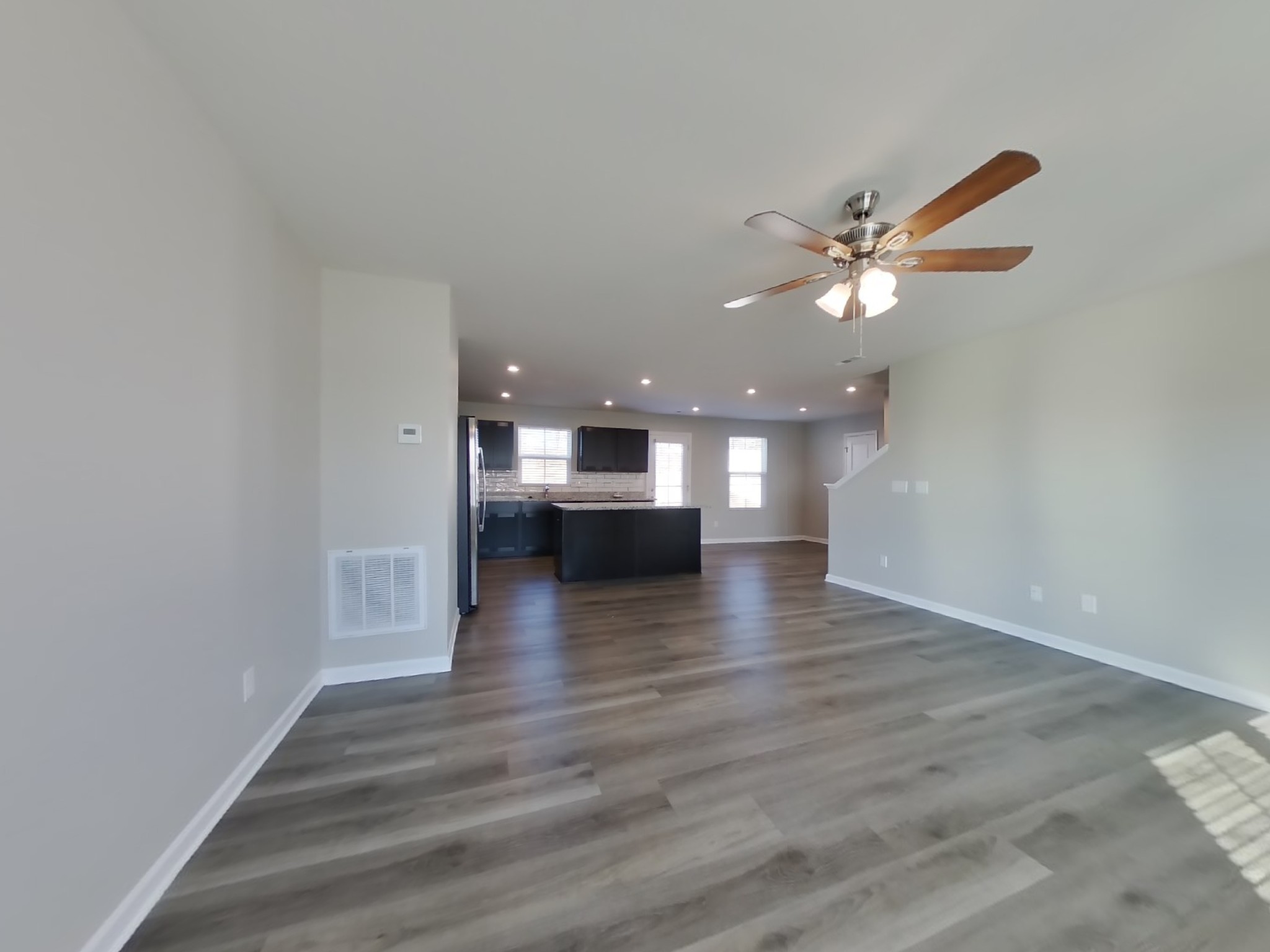 2108 Somersby Trail Spring Hill, TN 37174 - Photo 3 of 18 a view of an empty room with wooden floor and a window