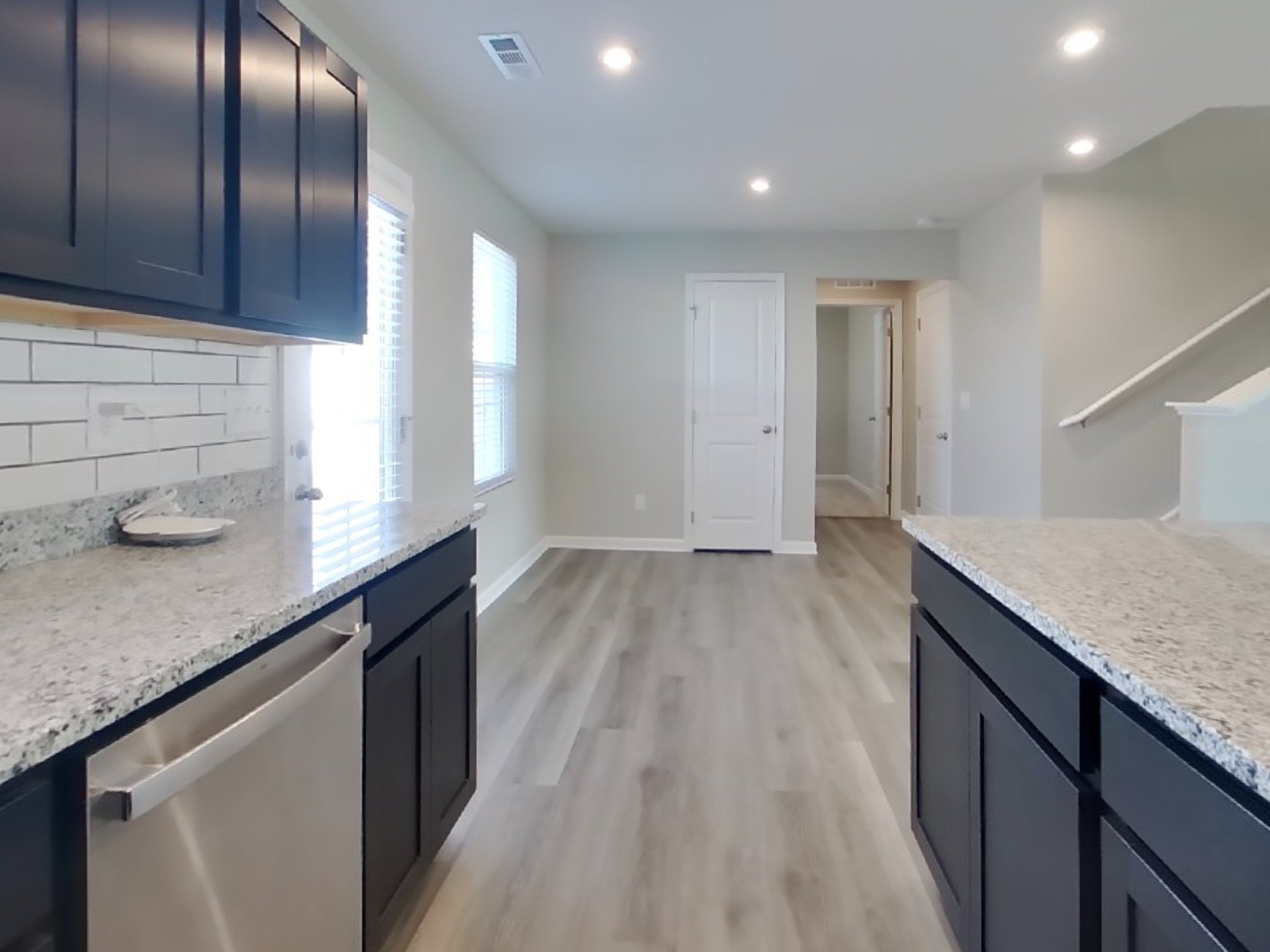 2108 Somersby Trail Spring Hill, TN 37174 - Photo 6 of 18 a kitchen with granite countertop cabinets a sink and dishwasher in it