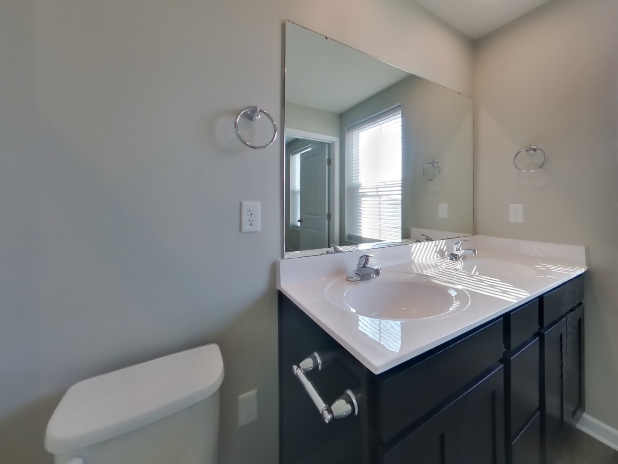 2108 Somersby Trail Spring Hill, TN 37174 - Photo 10 of 18 a bathroom with a toilet sink and mirror