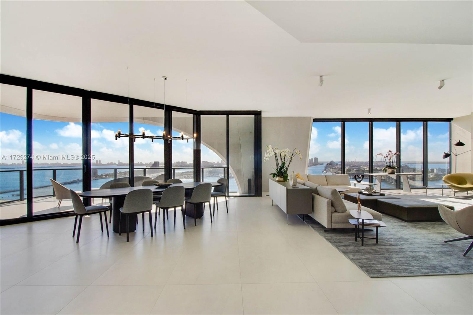 1000 Biscayne Boulevard, Unit 2302 Miami, FL 33132 - Photo 13 of 24 a living room with furniture and floor to ceiling window