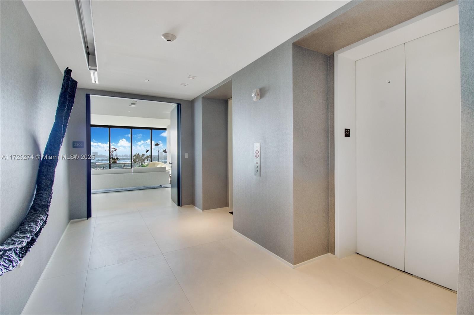 1000 Biscayne Boulevard, Unit 2302 Miami, FL 33132 - Photo 23 of 24 a view of a hallway with wooden shelves