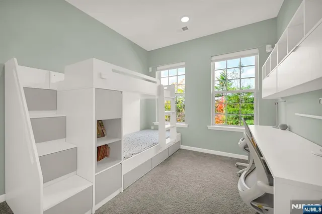 a view of a livingroom with furniture and windows