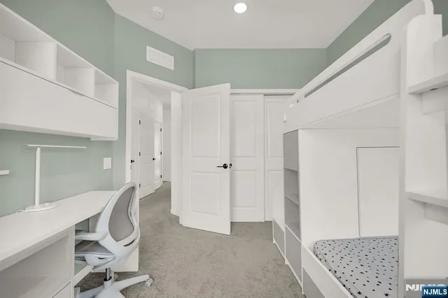 a view of room with furniture and wooden floor