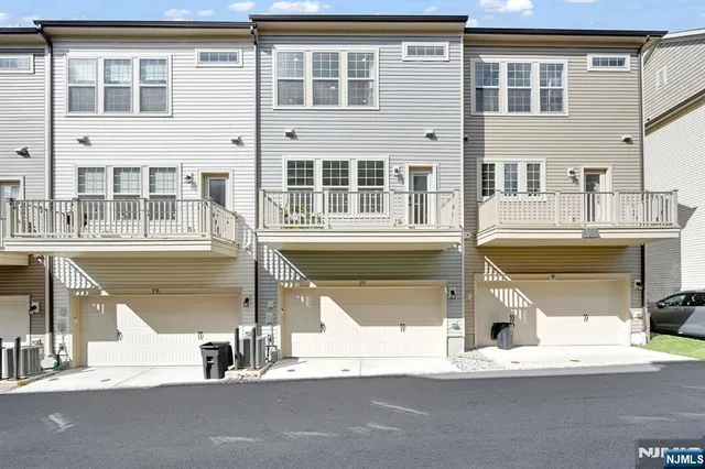 a view of a building with a car park side of road