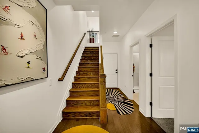 a view of entryway with wooden floor