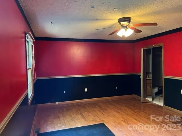 a view of room with a projector screen and lamp