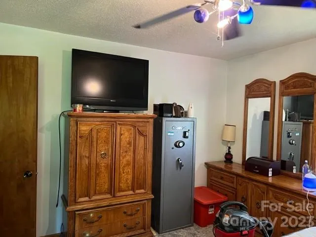 a living room with furniture and flat screen tv