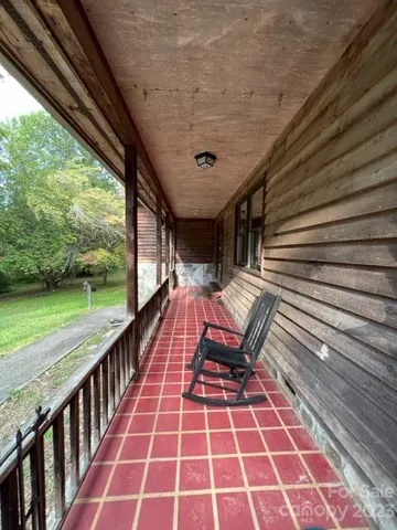 a view of a balcony with furniture