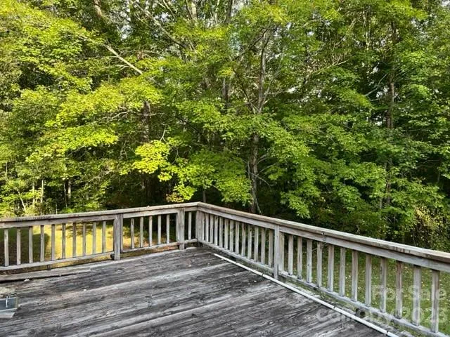a view of balcony with wooden floor