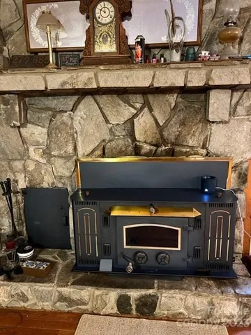 a stove top oven sitting inside of a kitchen