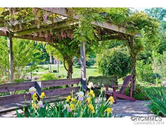 205 Souther Road Fletcher, NC 28732 - Photo 15 of 16 a view of a chairs and table in the garden