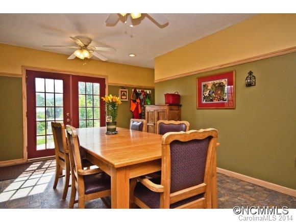 205 Souther Road Fletcher, NC 28732 - Photo 7 of 16 a view of a dining room with furniture window and wooden floor