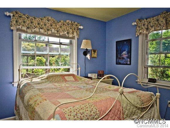 205 Souther Road Fletcher, NC 28732 - Photo 8 of 16 a bedroom with a bed and a window