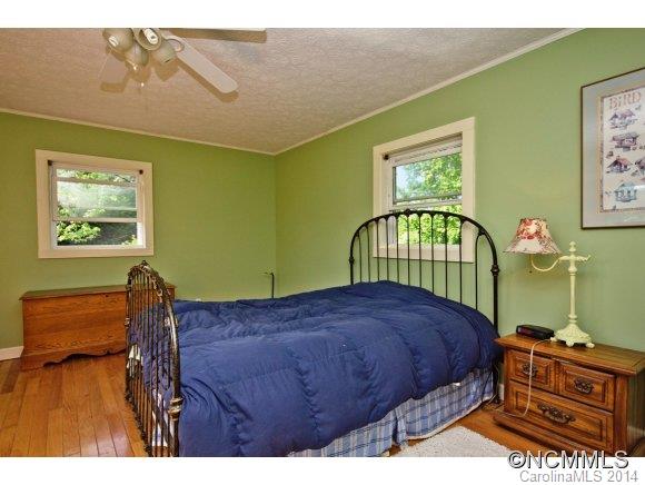 205 Souther Road Fletcher, NC 28732 - Photo 9 of 16 a bedroom with a bed next to a window