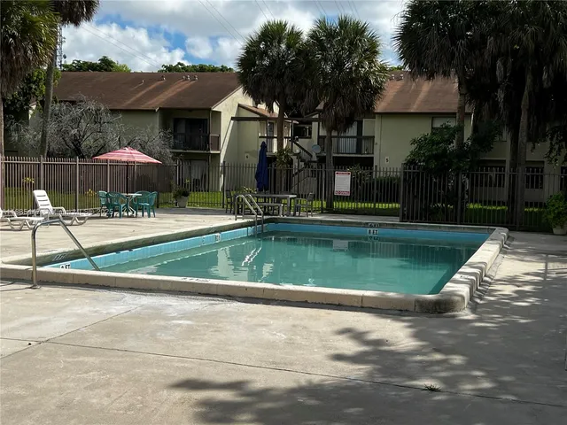 a view of a playground with basketball court