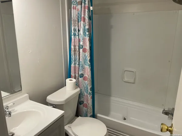 a view of an empty room with a garage