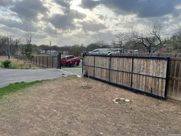 a kitchen with stainless steel appliances granite countertop a refrigerator a stove a sink and dishwasher