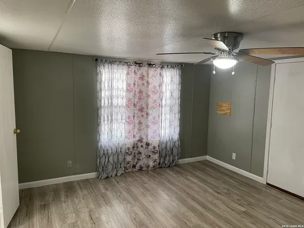 a view of a livingroom with wooden floor