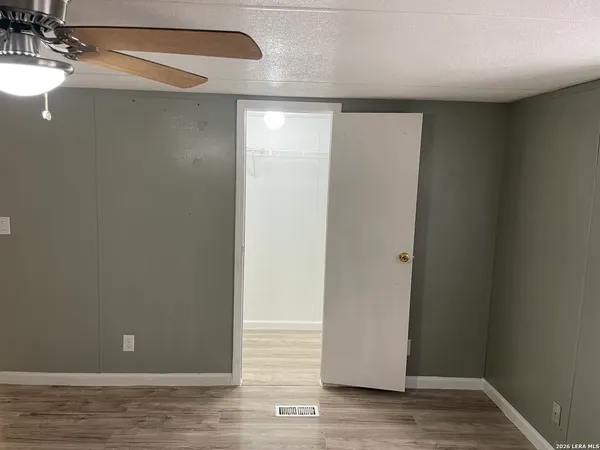 a bathroom with a sink vanity granite tub and shower