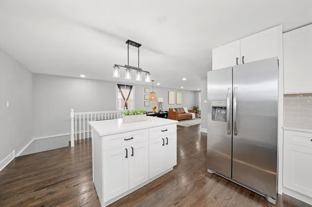 a kitchen with a refrigerator a sink and a stove