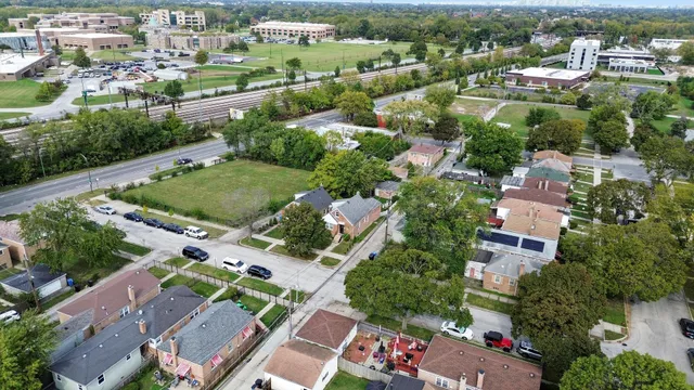 an aerial view of residential houses with outdoor space