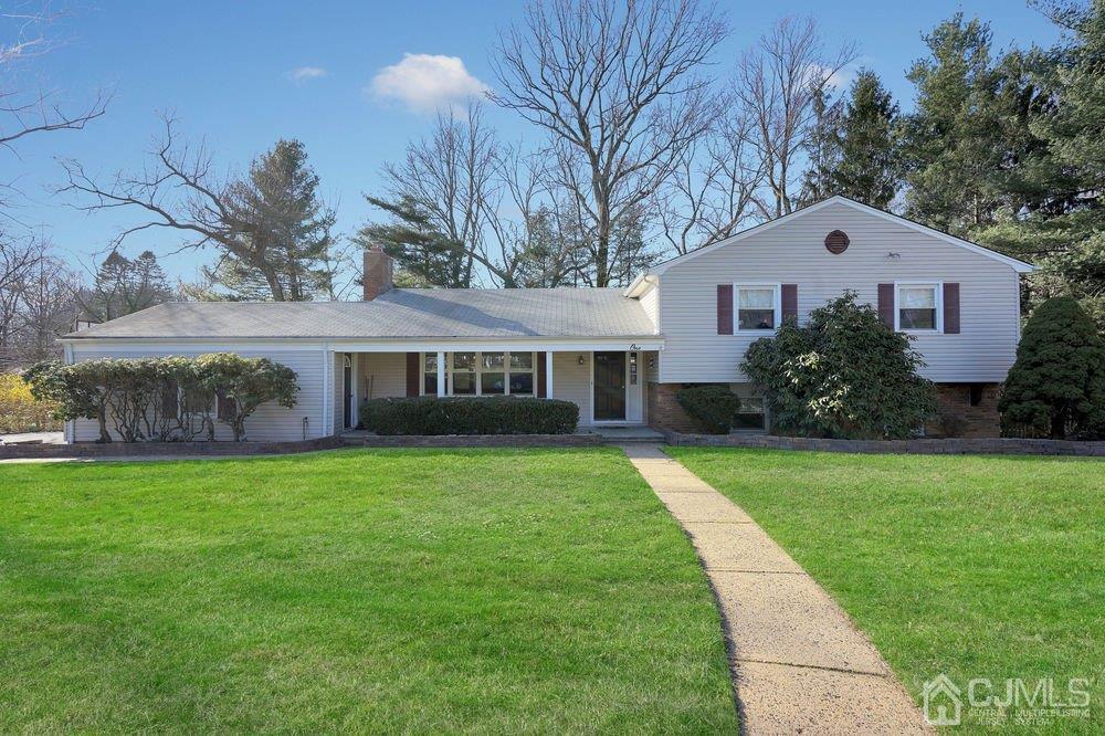 1 Wallace Road Middletown, NJ 07748 - Photo 1 of 28 a front view of a house with garden
