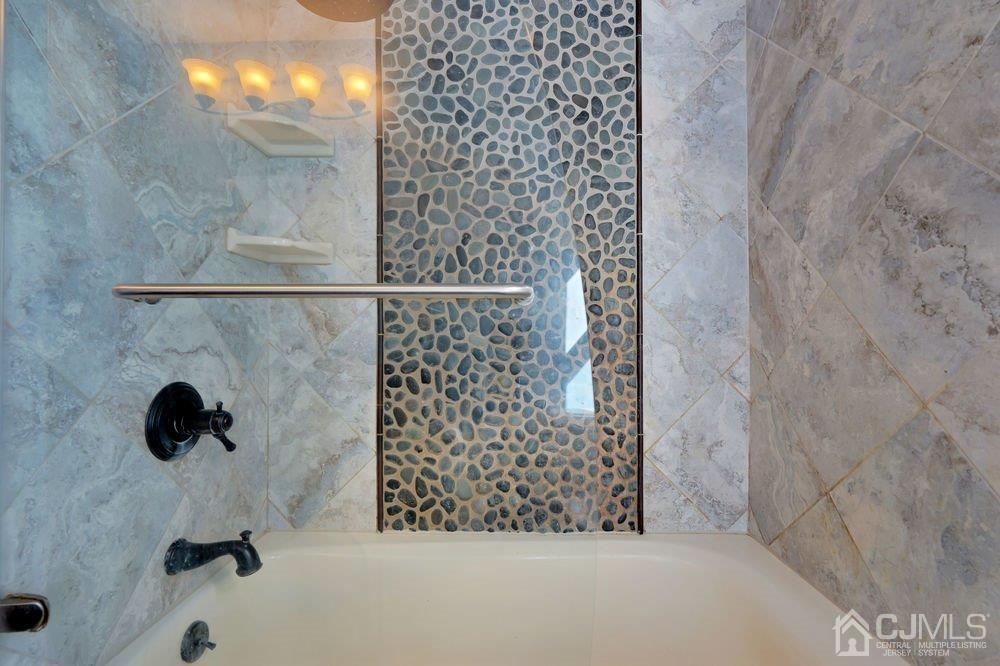 1 Wallace Road Middletown, NJ 07748 - Photo 11 of 28 a bathroom with a shower