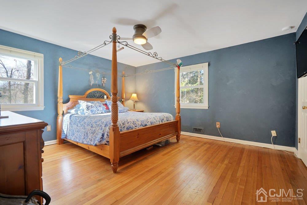 1 Wallace Road Middletown, NJ 07748 - Photo 13 of 28 a bedroom with a bed and window
