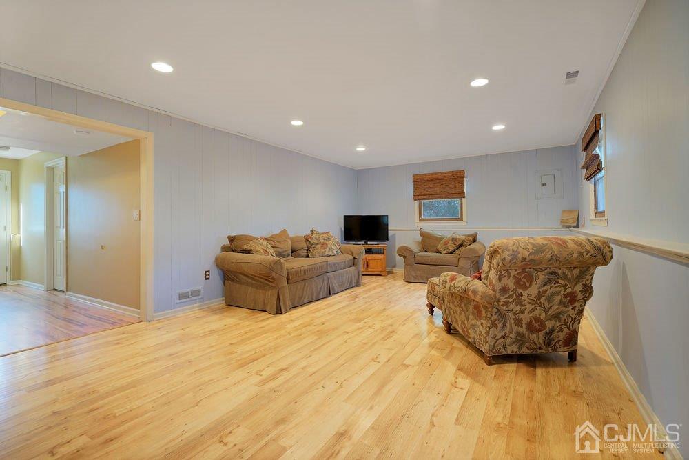1 Wallace Road Middletown, NJ 07748 - Photo 19 of 28 a bedroom with a bed and couch