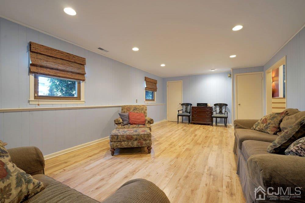 1 Wallace Road Middletown, NJ 07748 - Photo 20 of 28 a bedroom with furniture and a wooden floor