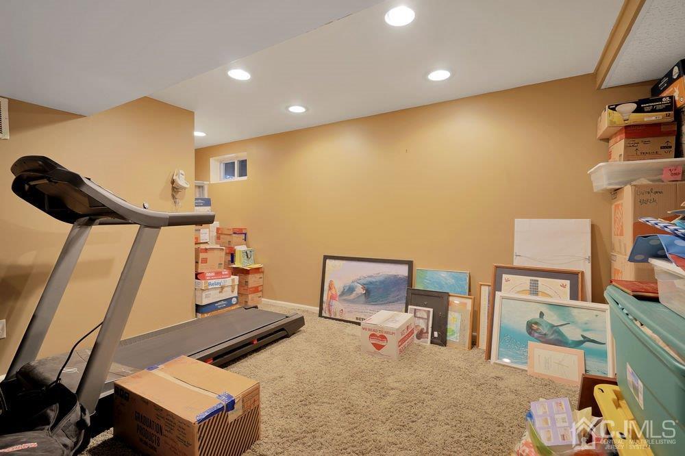 1 Wallace Road Middletown, NJ 07748 - Photo 24 of 28 a room with furniture and a flat screen tv