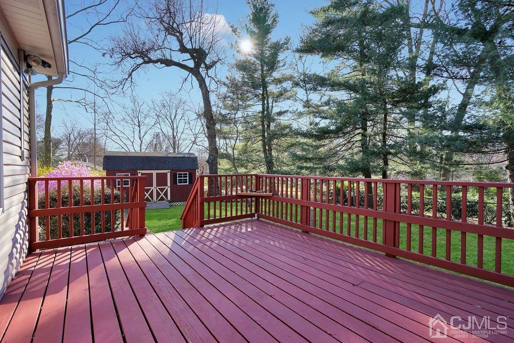 1 Wallace Road Middletown, NJ 07748 - Photo 25 of 28 a balcony with wooden floor and outdoor space