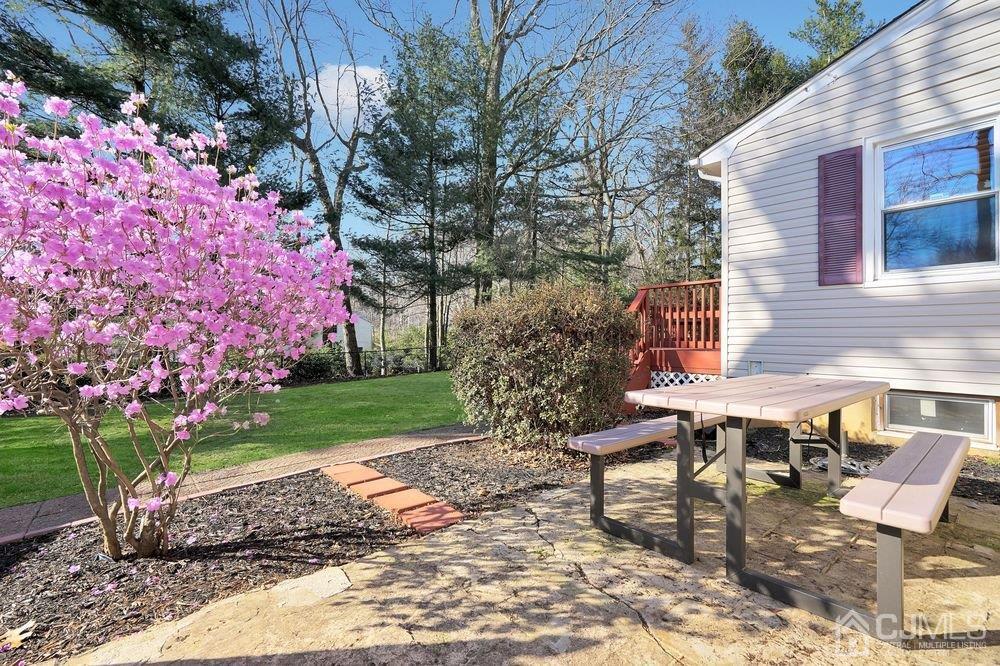 1 Wallace Road Middletown, NJ 07748 - Photo 26 of 28 a backyard of a house with table and chairs